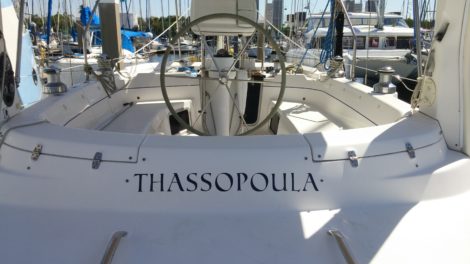 "Thassopoula" boat name installed on center cockpit sailboat