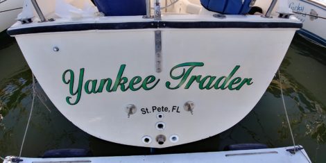 Vinyl boat name installed in St Petersburg FL with floating work platform