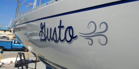 "Gusto" vinyl sailboat name with wind graphic installed in Salt Creek St. Petersburg FL