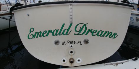 Vinyl boat name installed at St Pete Municipal Arena in slip