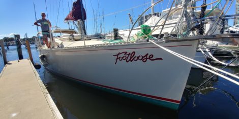 "Footloose" vinyl boat name installed on bow At Saint Petersburg Municipal Marina