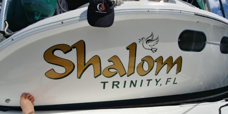 "Shalom" custom vinyl sailboat name with dove artwork in Ruskin FL